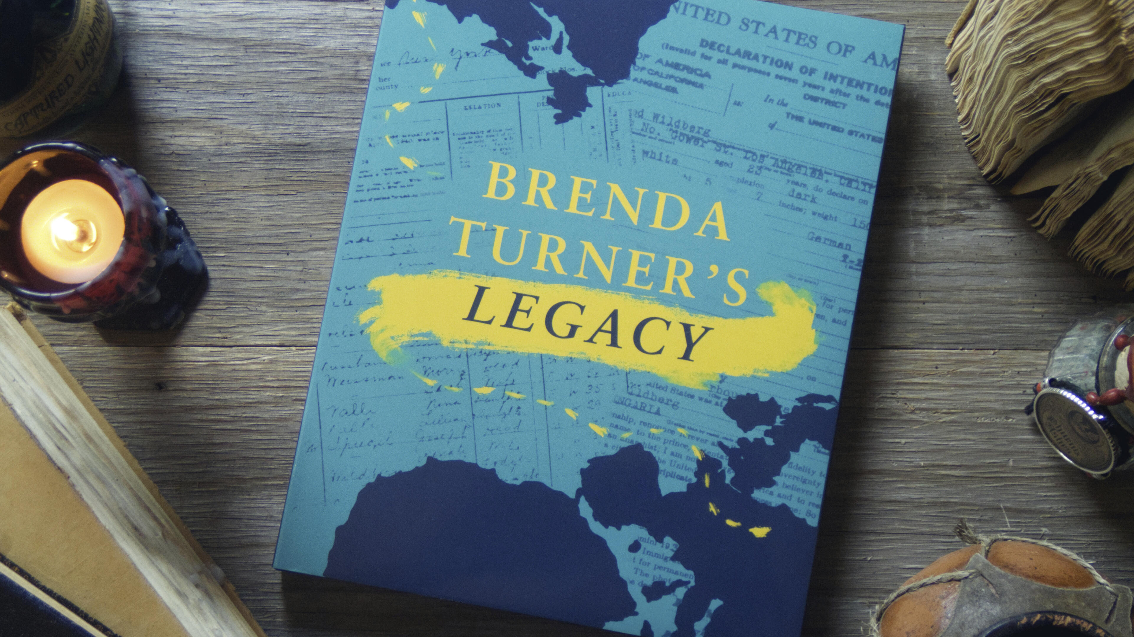 Brenda Turner (Front) This time, a large hardcover is shown. Its book jacket shows a background of scanned travel documents from the subject's life, with a dotted brushstroke showing her path. It reads: Brenda Turner's Legacy